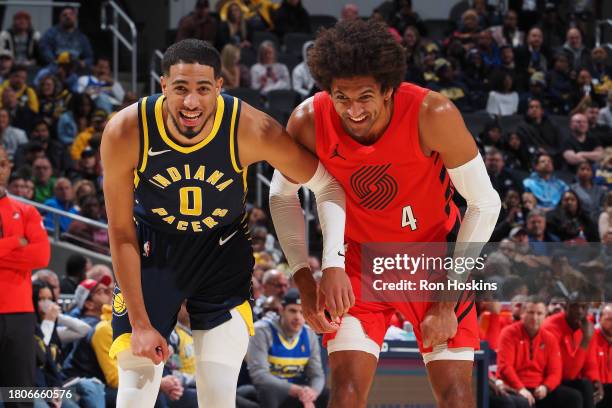 Tyrese Haliburton of the Indiana Pacers and Matisse Thybulle of the Portland Trail Blazers smile during the game on November 27, 2023 at Gainbridge...