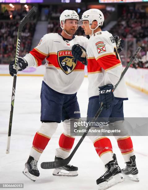 Sam Reinhart of the Florida Panthers celebrates his second period goal against the Ottawa Senators with teammate Sam Bennett at Canadian Tire Centre...