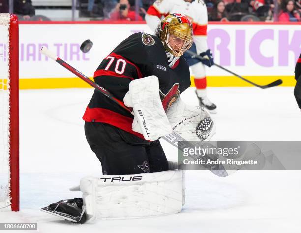 Joonas Korpisalo of the Ottawa Senators makes a save against the Florida Panthers at Canadian Tire Centre on November 27, 2023 in Ottawa, Ontario,...