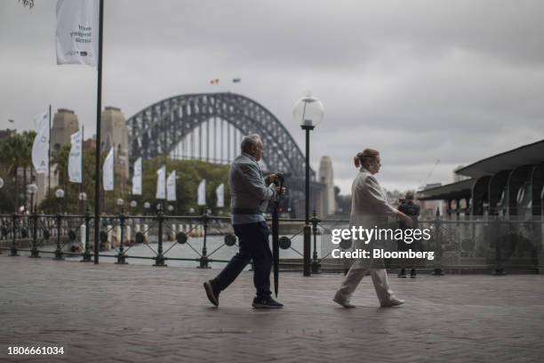 People walk near Sydney Harbour Bridge in Sydney, Australia, on Tuesday, Nov. 28, 2023. Australia plans to enshrine an objective of superannuation in...