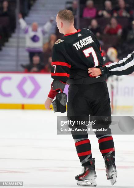 Brady Tkachuk of the Ottawa Senators is escorted after a fight against the Florida Panthers during the third period at Canadian Tire Centre on...