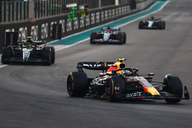F1 Abu Dhabi Grand Prix 2023Sergio Perez of Red Bull Racing and Lewis Hamilton of Mercedes during the Formula 1 Abu Dhabi Grand Prix at Yas Marina Circuit in Abu Dhabi, United Arab Emirates on November 26, 2023.