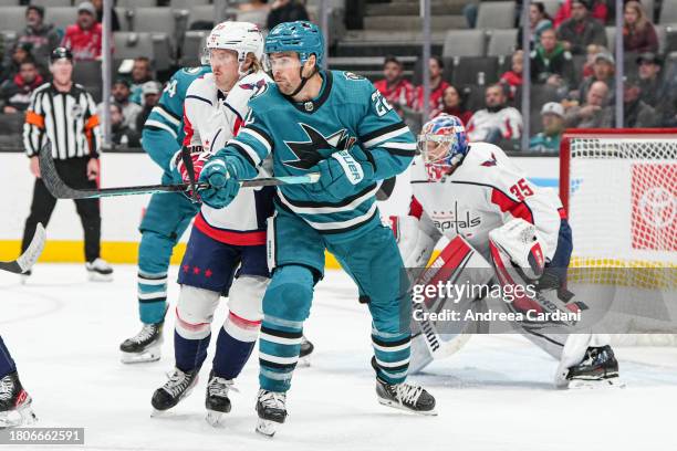 November 24: Ryan Carpenter of the San Jose Sharks battling in front of the net against the Washington Capitals at SAP Center on 11/27/23, 2023 in...