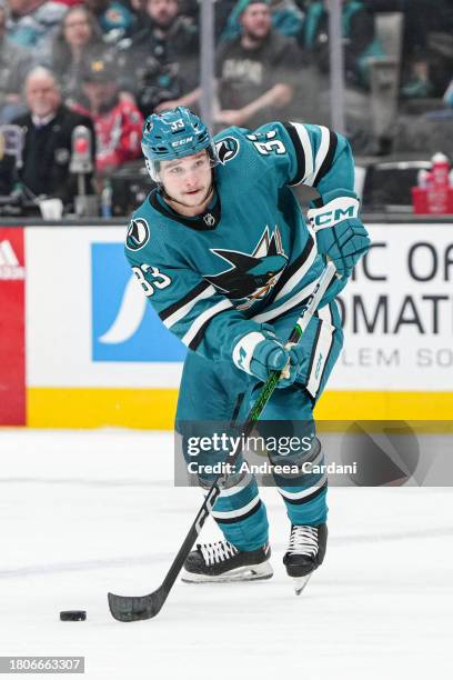 November 24: Calen Addison of the San Jose Sharks skating with the puck against the Washington Capitals at SAP Center on November 27, 2023 in San...