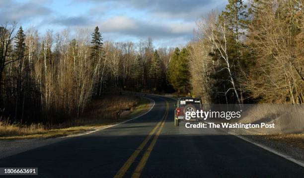 Rural mail carrier Dennis Nelson making deliveries in remote northern Minnesota in his vehicle November 25, 2023. The Bemidji Post Office has been...