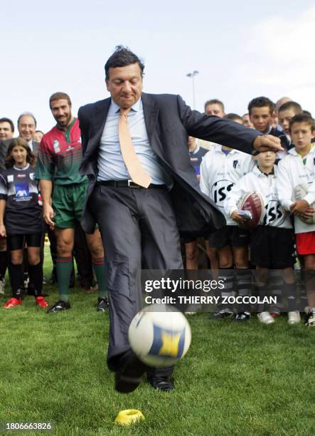 European Commission President Jose Manuel Barroso kicks the ball during a visit in support of Portuguese national rugby team 01 September 2007 in...