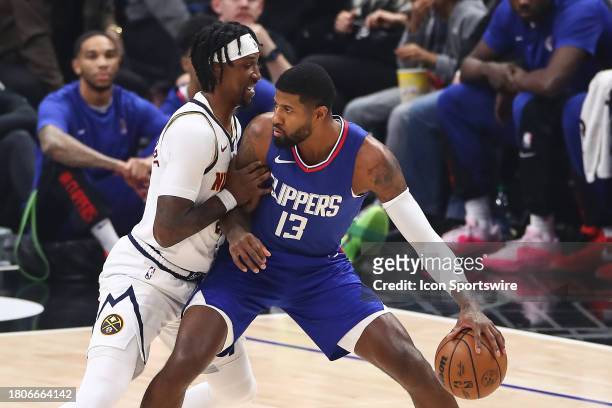 Clippers forward Paul George backs down Denver Nuggets guard Kentavious Caldwell-Pope during the Denver Nuggets game versus the Los Angeles Clippers...