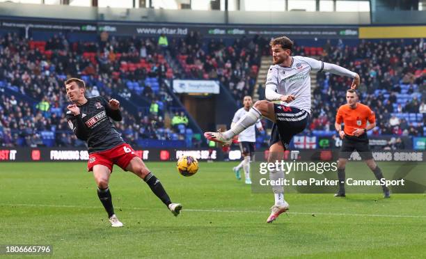 Bolton Wanderers' Jack Iredale shot is blocked by Exeter City's Tom Carroll during the Sky Bet League One match between Bolton Wanderers and Exeter...