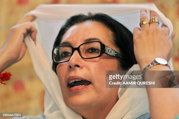 Former Pakistani prime minister Benazir Bhutto gestures as she addresses a news conference in Islamabad, 08 November 2007. Bhutto said that President...