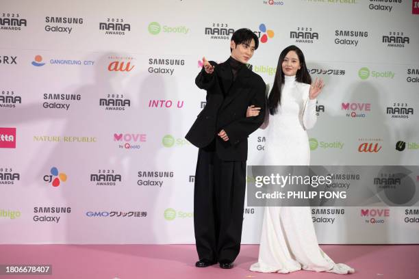 South Korean singer and actor Hwang Min-hyun and South Korean actress Kim So-hyun attend a red carpet event at the 2023 Mama Awards at the Tokyo Dome...