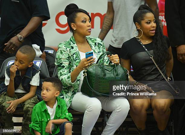 Monica Brown and Toya Wright attend LudaDay Weekend Celebrity Basketball Game at Georgia State University on September 1, 2013 in Atlanta, Georgia.