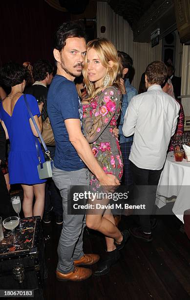 Sienna Miller and Matthew Wiliamson attend the Matthew Williamson after party during London Fashion Week SS14 at The Box Soho on September 15, 2013...