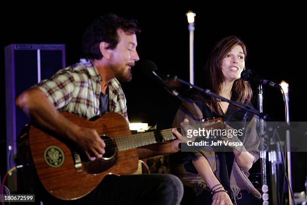Eddie Vedder and Jeanne Tripplehorn peform onstage during Eddie Vedder and Zach Galifianakis Rock Malibu Fundraiser for EBMRF and Heal EB on...