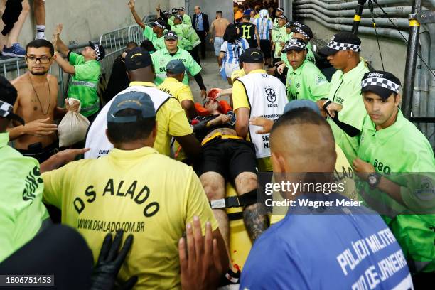 Fan is carried on a stretcher with injuries due to incidents in the stands prior to a FIFA World Cup 2026 Qualifier match between Brazil and...