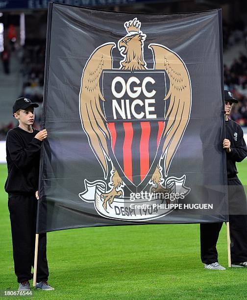 The flag of Nice's football club is presented before the French L1 football match Lille vs Nice on September 15, 2013 at the "Grand Stade" Stadium in...