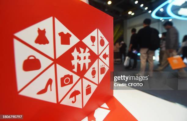 Visitors visit the booth of Pinduoduo in Hangzhou, East China's Zhejiang province, Nov 23, 2023. On November 28 Pinduoduo released revenue of 68.84...