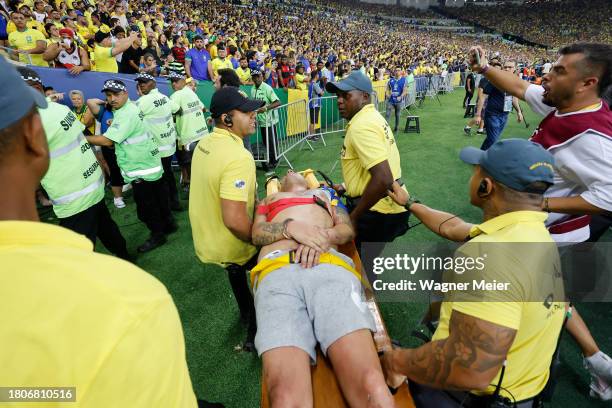 Fan is carried on a stretcher with injuries due to incidents in the stands prior to a FIFA World Cup 2026 Qualifier match between Brazil and...