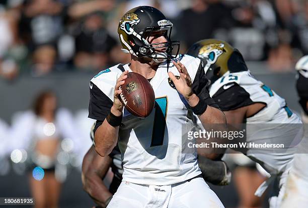 Chad Henne of the Jacksonville Jaguars drops back to pass against the Oakland Raiders during the fourth quarter at O.co Coliseum on September 15,...