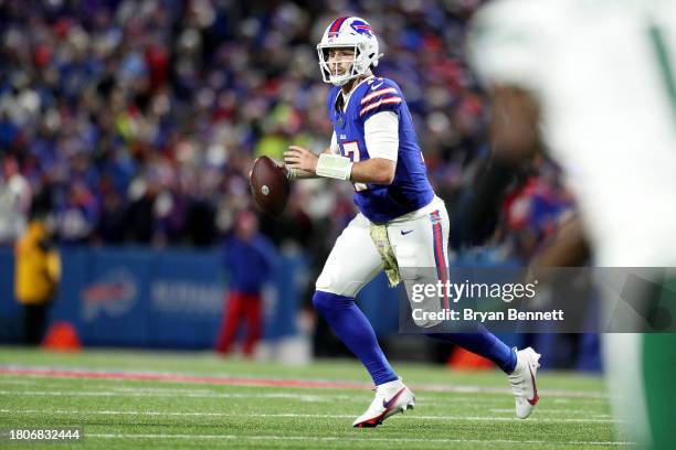 Josh Allen of the Buffalo Bills looks to pass the ball during the second quarter against the New York Jets at Highmark Stadium on November 19, 2023...