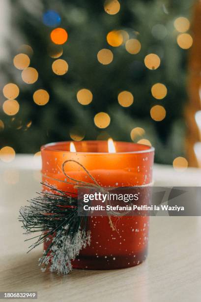 christmas candle on table - scented stock pictures, royalty-free photos & images