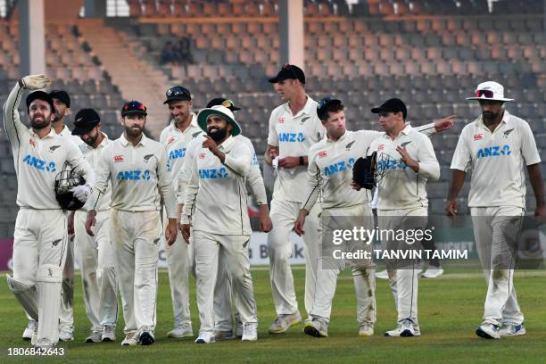 New Zealand's cricketers walk off the field at the end of the first day of the first Test cricket match between Bangladesh and New Zealand at the...