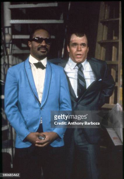 American musician Stevie Wonder and comedian Joe Piscopo perform a skit on an episode of 'Saturday Night Live,' New York, New York, 1983.