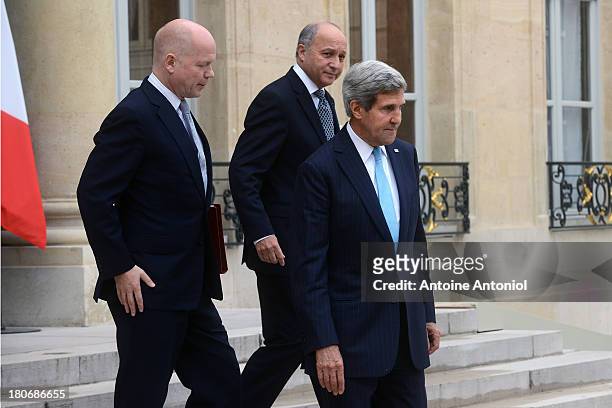 British Foreign Secretary William Hague , US Secretary of State John Kerry and French Foreign minister Laurent Fabius leave the Elysee Palace on...