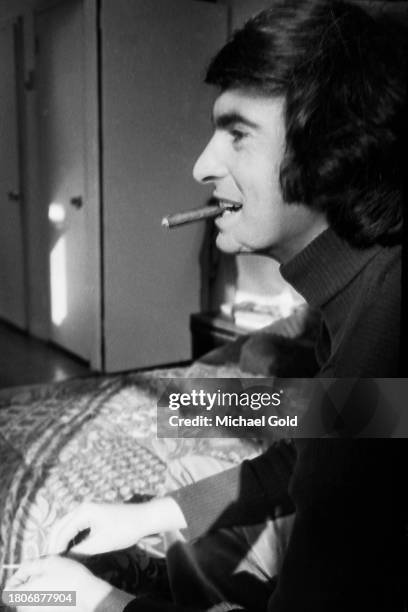 Comedian David Steinberg smoking a cigar in an apartment in New York City in 1972.
