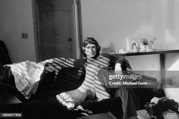 Comedian David Steinberg "nursing" an enlarged, swollen foot in an apartment in New York City in 1972.