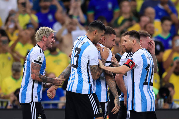 Nicolas Otamendi of Argentina celebrates with teammate Lionel Messi after scoring the team's first goal during a FIFA World Cup 2026 Qualifier match...