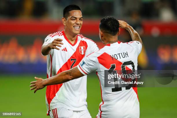 Yosimar Yotun celebrates with Joao Grimaldo of Peru after scoring the team's first goal during the FIFA World Cup 2026 Qualifier match between Peru...