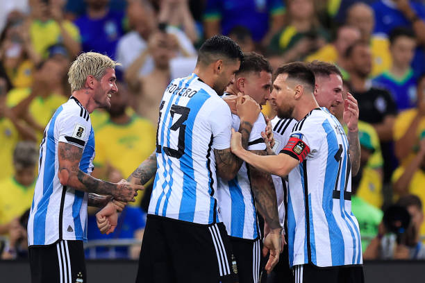 Nicolas Otamendi of Argentina celebrates with teammate Lionel Messi after scoring the team's first goal during a FIFA World Cup 2026 Qualifier match...
