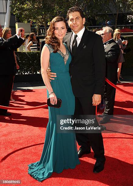 Actress Linda Cardellini and husband Steven Rodriguez attend the 2013 Creative Arts Emmy Awards at Nokia Theatre L.A. Live on September 15, 2013 in...