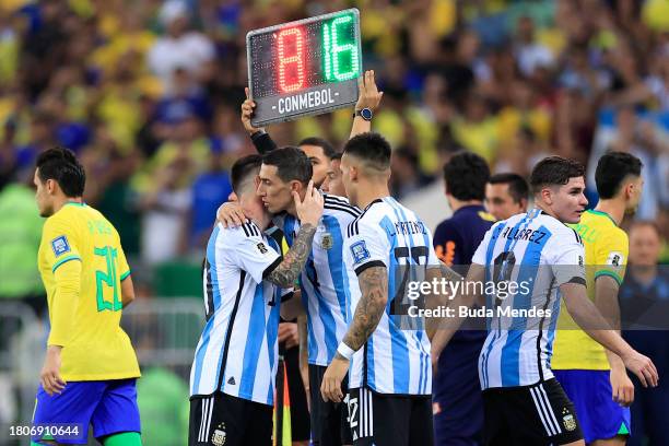 Lionel Messi of Argentina greets teammate Angel Di Maria in a substitution during a FIFA World Cup 2026 Qualifier match between Brazil and Argentina...