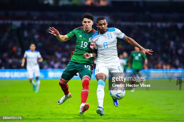 Jorge Sanchez of Mexico battles for the ball against Joseph Rosales of Honduras during the CONCACAF Nations League quarterfinals second leg match...