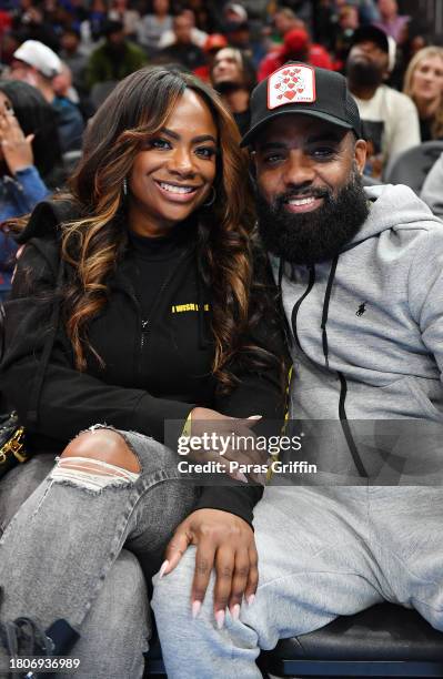 Kandi Burruss and Todd Tucker attend the NBA In-Season Tournament game between the Indiana Pacers and the Atlanta Hawks at State Farm Arena on...