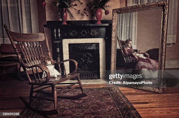 ghost of little girl sitting in the rocker chair (ii) - dead girl stock pictures, royalty-free photos & images