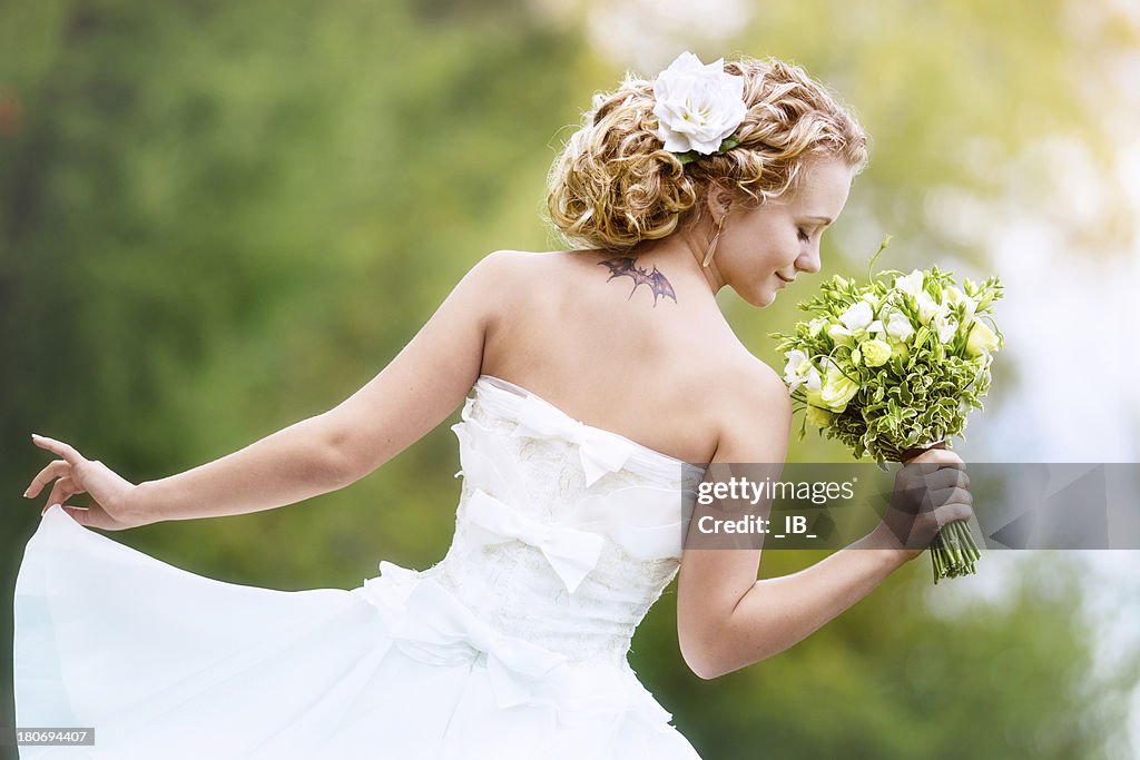 Portrait of charming bride with a bouquet