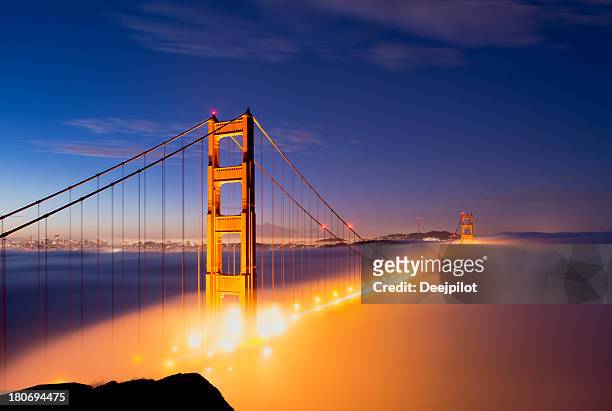 golden gate bridge with fog in san francisco usa - golden gate bridge night stock pictures, royalty-free photos & images