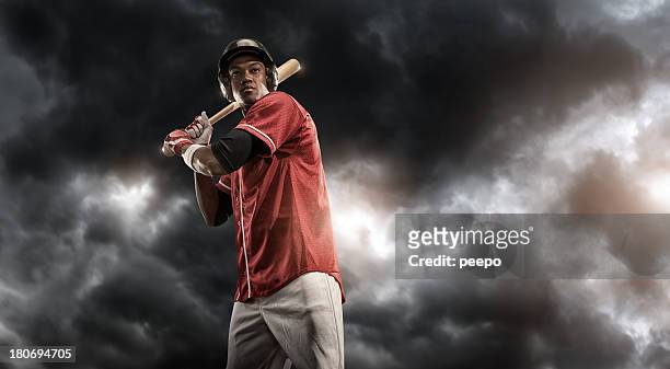 intense baseball player - baseball swing stock pictures, royalty-free photos & images