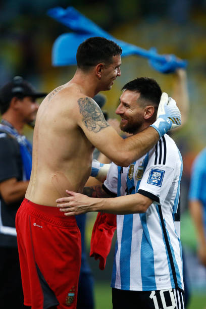 Emiliano Martinez of Argentina celebrates with teammate Lionel Messi after winning a FIFA World Cup 2026 Qualifier match between Brazil and Argentina...