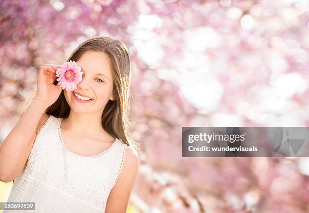 teenager enjoying spring time - gerbera daisy stock pictures, royalty-free photos & images