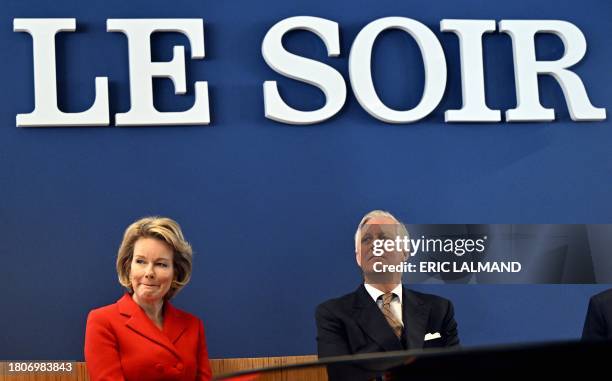 King Philippe - Filip of Belgium and Queen Mathilde of Belgium pictured during a royal visit to the editorial floor of the newspaper Le Soir, in...