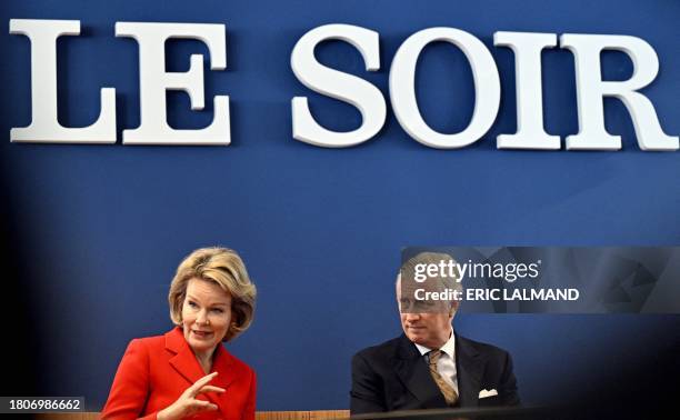 King Philippe - Filip of Belgium and Queen Mathilde of Belgium pictured during a royal visit to the editorial floor of the newspaper Le Soir, in...