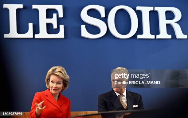 King Philippe - Filip of Belgium and Queen Mathilde of Belgium are pictured during a visit to the editorial floor of the newspaper Le Soir, in...