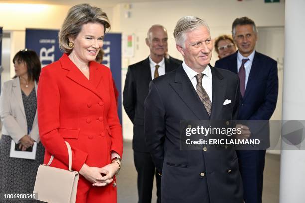 King Philippe - Filip of Belgium and Queen Mathilde of Belgium pictured during a royal visit to the editorial floor of the newspaper Le Soir, in...