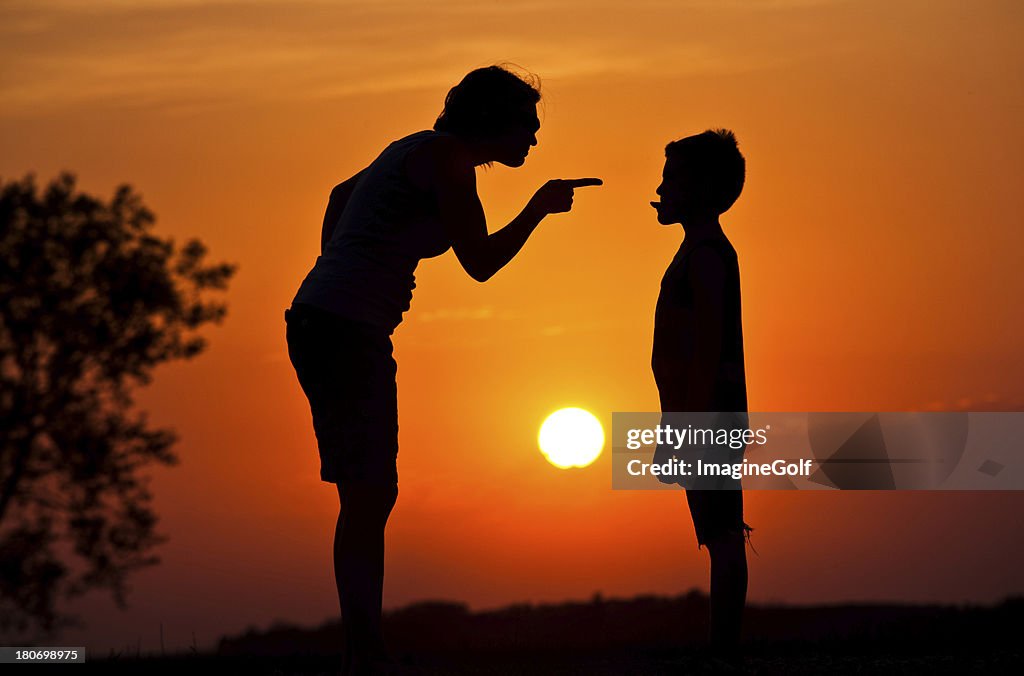 Silhouette of Mother Scolding A Disrespectful Child