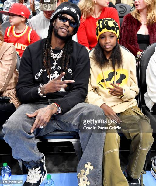 Chainz and Harmony Epps attend the NBA In-Season Tournament game between the Indiana Pacers and the Atlanta Hawks at State Farm Arena on November 21,...