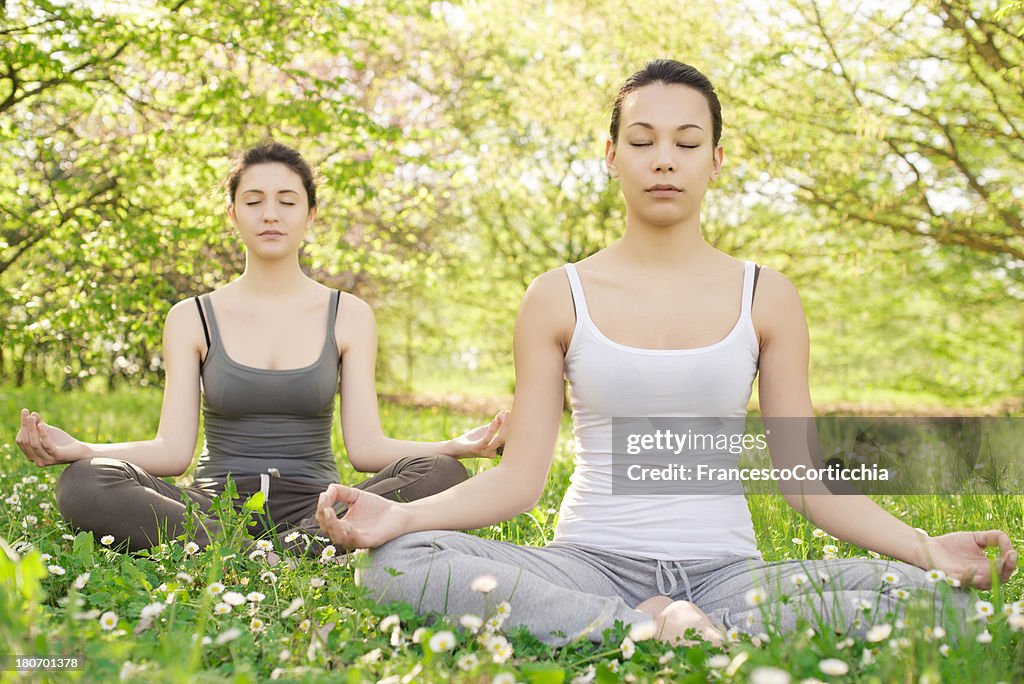 Two young woman meditation