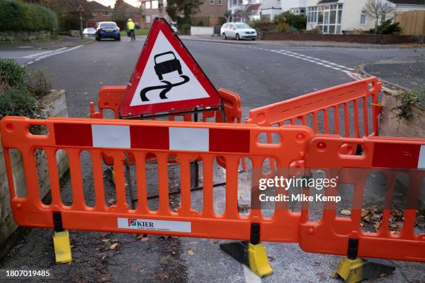 Flattened low-traffic neighbourhood bollard in Moseley following a driver intentionally attempting to drive through it and now surrounded by red...